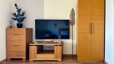 a wooden desk with a television on top of it at GARDEN OF EDEN Modern Apartments - APARTELLO,com in Sveti Vlas