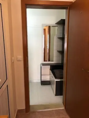 a hallway with a door to a room with a mirror at Dunav Apt.1 in Ravda