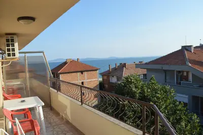 a balcony with a view of the ocean at Stamatovi Family Hotel in Pomorie