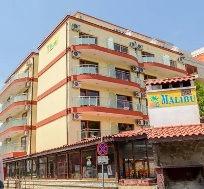 a large building with a sign on the side of it at Hostel Malibu in Sunny Beach