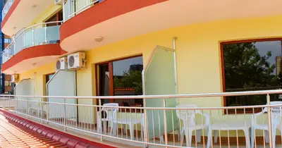 a balcony of a building with chairs on it at Hostel Malibu in Sunny Beach