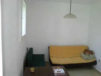a living room with a couch and a table at Burgas Urban Studio -Budjet Studio in Burgas City