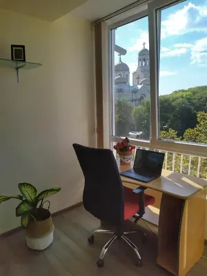 an office with a desk with a laptop and a window at By the CATHEDRAL · TOP center · 2 Bedroom FLAT in Varna City