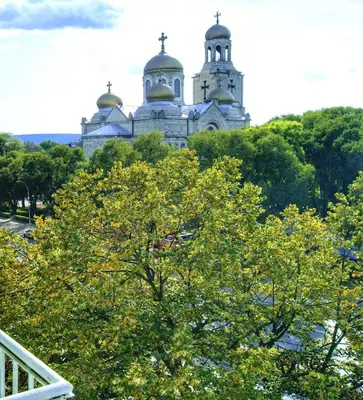 a building with two domes on top of a tree at By the CATHEDRAL · TOP center · 2 Bedroom FLAT in Varna City