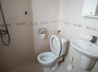 a bathroom with a toilet and a sink at Casablanca City in Varna City