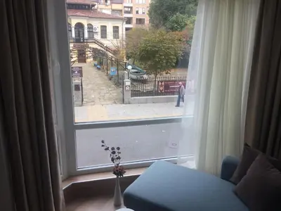a window with a view of a city street at Апартамент Мони in Burgas City