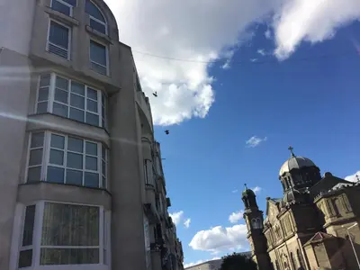 a building with a cross on the top of it at Апартамент Мони in Burgas City