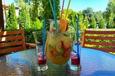 a table with two glasses of juice on a table at Arkite Complex in Sunny Beach