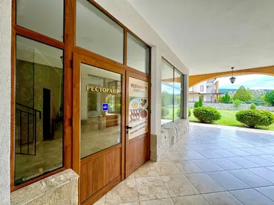a entrance to a building with a large glass door at Arkite Complex in Sunny Beach
