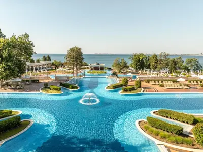 a pool at a resort with a water slide at Dreams Sunny Beach Resort and Spa - Premium All Inclusive in Sunny Beach