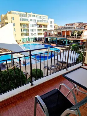 a balcony with a view of a swimming pool at Pool View Studio, Pollo Resort, Sunny Beach in Sunny Beach