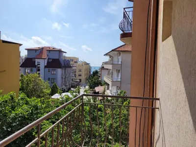 a balcony with a view of a city at Guesthouse Iceberg in Ravda