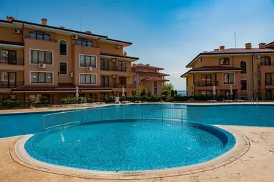 a large swimming pool in front of some buildings at Menada Sky Dreams Apartments in Sveti Vlas