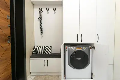 a laundry room with a washer and dryer in it at Joy Apartment Burgas center free parking in Burgas City