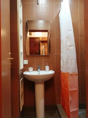 a bathroom with a sink and a mirror at INFINITY Blue 2 in Burgas City