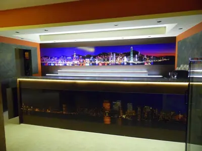 a bar with a view of a city at night at Hotel Amigos in Obzor