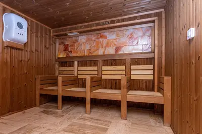 a sauna with benches in a wooden room at Sunny Paradise ll in Kiten