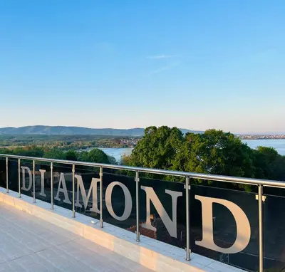 a sign that reads diamondontario on a fence at Diamond Kiten in Kiten