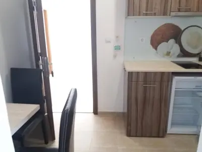 a kitchen with a counter and a stove top oven at Diamond Kiten in Kiten
