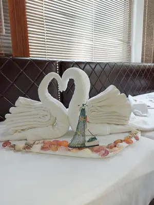 two swans sitting on top of a table at Diamond Kiten in Kiten
