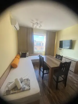 a room with a dining table and a bed at AMADEUS 5 in Sunny Beach
