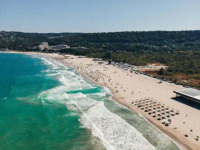 an aerial view of a beach with umbrellas at ApartHotel Asparuh Studio3 in Varna City