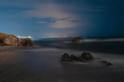 a foggy beach with rocks in the water at JI HOTEL in Sozopol