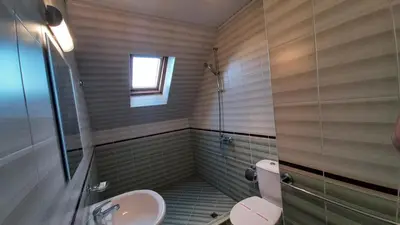 a bathroom with a sink and a toilet and a shower at Adri Guest House in Nesebar