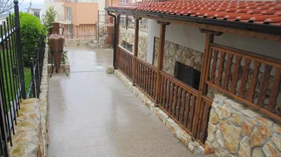 a balcony of a house with a fence at Neli Sea Villa in Sozopol