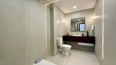 a bathroom with a toilet and a sink and a mirror at ROYAL BEACH - Modern & Private Apartments in center Sunny Beach in Sunny Beach