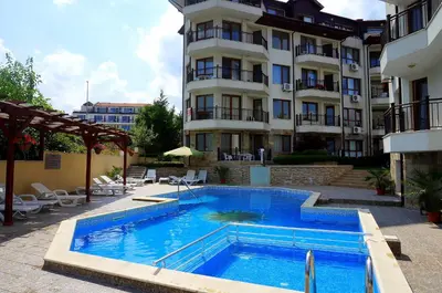 a large swimming pool in front of a building at Комплекс Бяла Виста до Плажа - Complex Byala Vista near the beach in Byala