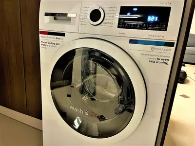 a washing machine is in a display case at Botabara 312 Beach Front Apartment in Pomorie