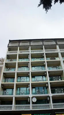 a tall building with balconies on the side of it at Miramar Front Beach Self Catering Apartments No Swim Pool Access in Sunny Beach