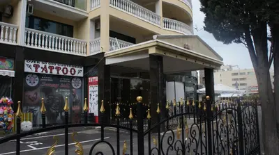 a black fence in front of a building at Miramar Front Beach Self Catering Apartments No Swim Pool Access in Sunny Beach