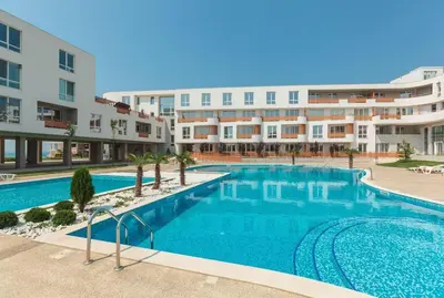 a large swimming pool in front of a building at Loli’s Beach Studio in Burgas City