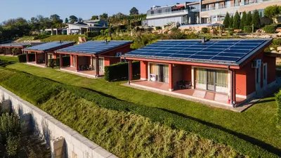 a row of houses with solar panels on the roof at Eco complex Zdravets near Varna in Zdravets