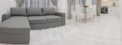 a living room with a couch and a table at Vip Luxury APARTMENT in Burgas City