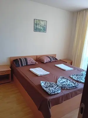 a bed in a room with two towels on it at Panorama Vigo Nesebar in Nesebar