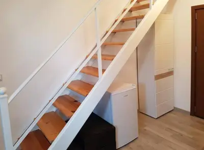 a white staircase in a room with a desk at SP Luxury Loft 28 in Ravda