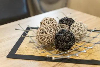 a wire basket with balls of yarn on a table at Blue Тerrace Apartment Top Center in Varna City