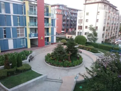 a courtyard in a city with buildings at Studios in Complex Elit 4 in Sunny Beach