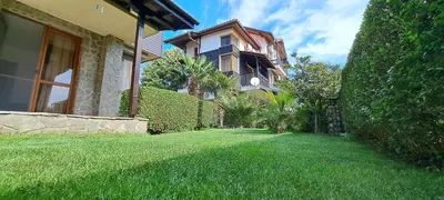 a house with a yard with a green lawn at Sani Holiday Village in Sozopol