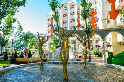 a statue of three girls in a fountain at Sweet Homes 6 Apartments in Sunny Beach