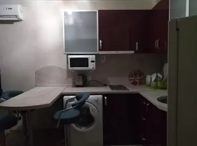 a kitchen with a counter and a sink and a microwave at RUBIN-2 in Pomorie