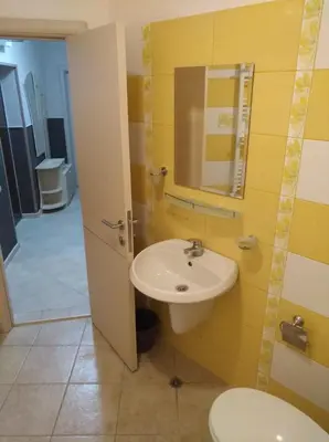a bathroom with a sink and a toilet at RUBIN-2 in Pomorie
