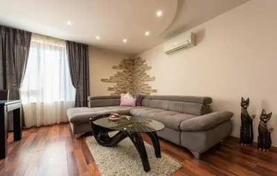 a living room with a couch and a table at Apartment Aventurine in Varna City