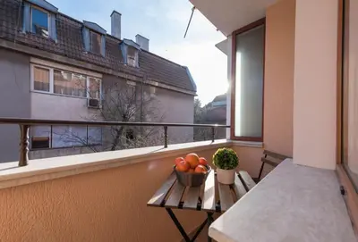 a bowl of fruit on a table on a balcony at Apartment Aventurine in Varna City
