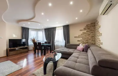 a living room with a couch and a table at Apartment Aventurine in Varna City