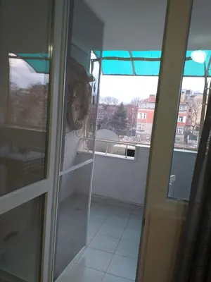 a room with a view of a balcony with a window at Апартамент Термите in Varna City