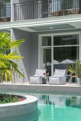 a house with a swimming pool next to a building at Siena Premium Retreat in Lozenets